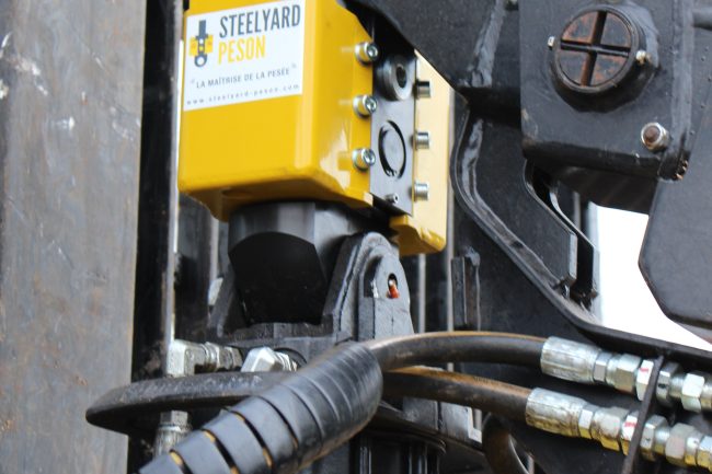 Steelyard Peson onboard weighing equipment fitted to a timber truck